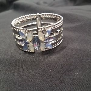 Cuff bracelet in silvertone with crystal floral de